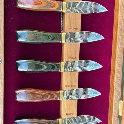 Sale Photo Thumbnail #110: Buck Knives Harley-Davidson engine series commemorative set of five fixed-blade knives in a velvet-lined wooden display box.