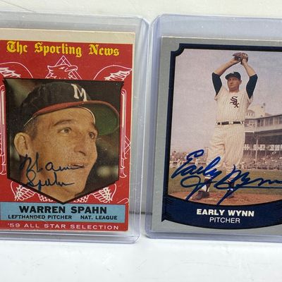 Sale Photo Thumbnail #84: Pair of vintage autographed baseball cards featuring Hall of Fame pitchers Warren Spahn and Early Wynn, both presented in protective top loader sleeves.