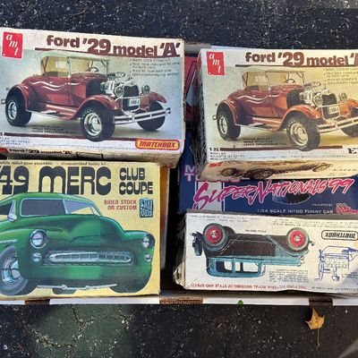Sale Photo Thumbnail #124: Assortment of vintage AMT plastic car model kits in original boxes, including '29 Ford Model A and '49 Merc Club Coupe.