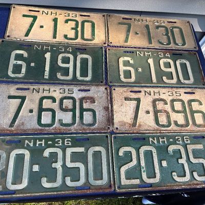 Sale Photo Thumbnail #18: Collection of vintage New Hampshire license plates from the 1930s, displaying various states of wear, patina, and surface rust.