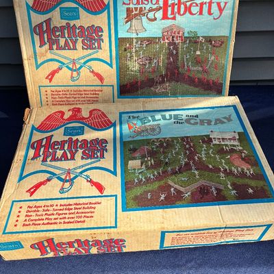 Sale Photo Thumbnail #6: Two vintage Sears Heritage Play Set boxes, including 'Sons of Liberty' and 'The Blue and the Gray', featuring historical plastic figures and accessories in original cardboard packaging.