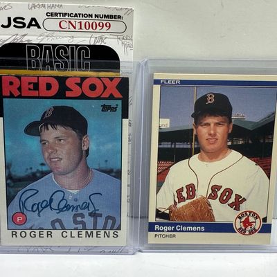 Sale Photo Thumbnail #91: Two Roger Clemens Boston Red Sox rookie-era baseball cards in top loaders, featuring a JSA-authenticated autographed 1985 Topps card alongside a 1985 Fleer card.