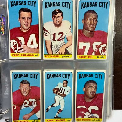Sale Photo Thumbnail #96: Binder page of six vintage 1968 Topps Kansas City Chiefs football cards, featuring players Fred Arbanas, Pete Beathard, Bobby Bell, Mel Branch, Tommy Brooker, and Buck Buchanan.