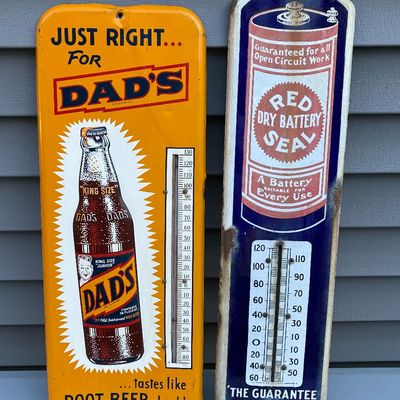 Sale Photo Thumbnail #64: Pair of vintage advertising metal thermometer signs, featuring Dad's Root Beer and Red Seal Dry Battery, showing minor surface wear and patina.