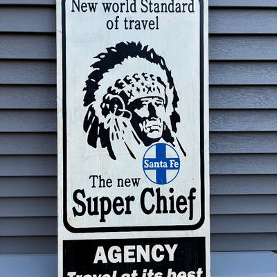 Sale Photo Thumbnail #62: Vintage Santa Fe Super Chief porcelain advertising sign with Native American chief graphic, displaying light edge wear.