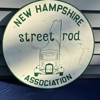 Sale Photo Thumbnail #23: Vintage circular New Hampshire Street Rod Association metal sign featuring a green and white graphic design with minor surface wear.