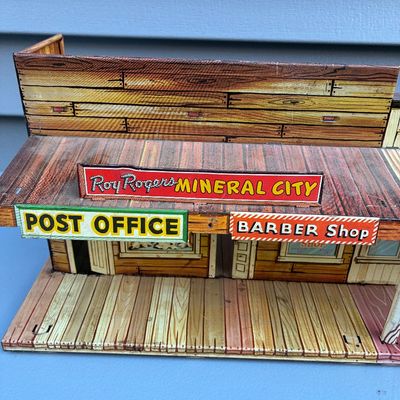 Sale Photo Thumbnail #71: Vintage Marx Roy Rogers Mineral City tin litho playset building featuring a Post Office and Barber Shop, circa 1950s.