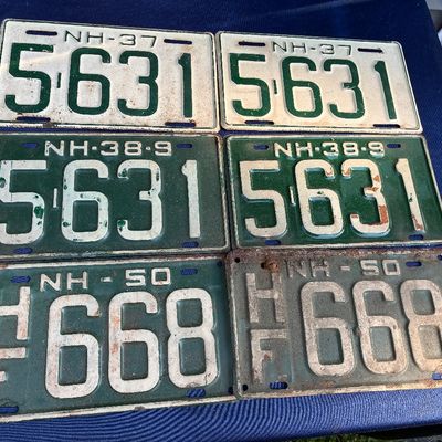 Sale Photo Thumbnail #19: Collection of six vintage New Hampshire license plate pairs from 1937, 1938-39, and 1950, displaying age-appropriate surface rust and paint wear.
