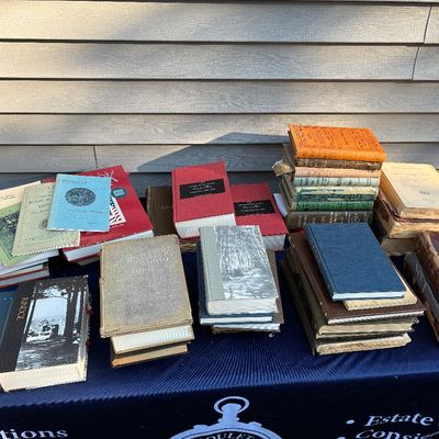 Sale Photo Thumbnail #31: Collection of antique and vintage local history books, pamphlets, and hardcovers arranged in stacks on a table.