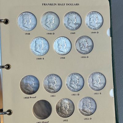 Sale Photo Thumbnail #77: Collector album page filled with US Franklin half dollars spanning dates from 1948 to 1952.