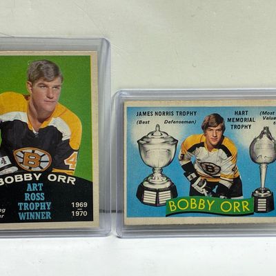 Sale Photo Thumbnail #87: Pair of vintage 1970-71 O-Pee-Chee or Topps Bobby Orr hockey trading cards housed in protective top loader sleeves.