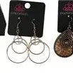 Collection of five pairs of Paparazzi brand costume dangle earrings, new on original display cards.