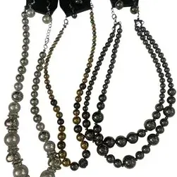 Set of three Paparazzi beaded costume jewelry necklaces, each paired with matching dangle earrings on original retail display cards.