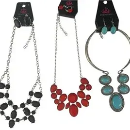 Set of three Paparazzi brand fashion statement necklaces with matching drop earrings in black, red, and turquoise blue tones.