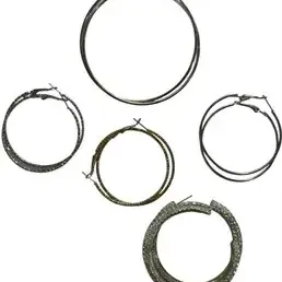 Collection of five pairs of dark metallic and textured hoop earrings in various sizes.