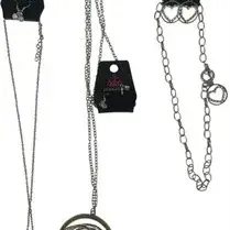 Set of three Paparazzi brand silver-tone costume jewelry pieces, including two pendant necklaces and a matching necklace and earring set.