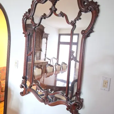Sale Photo Thumbnail #21: Ornate Rococo Revival style carved dark wood wall mirror featuring intricate scrollwork and a multi-pane design.