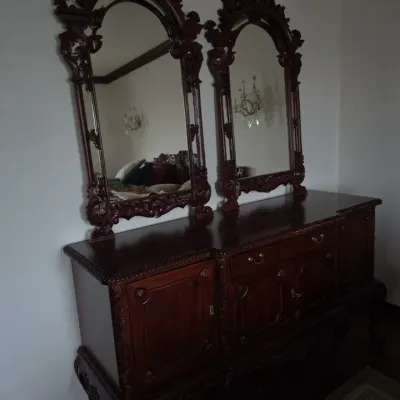 Sale Photo Thumbnail #36: Traditional dark wood sideboard dresser featuring intricate shell carvings and double attached arched mirrors.