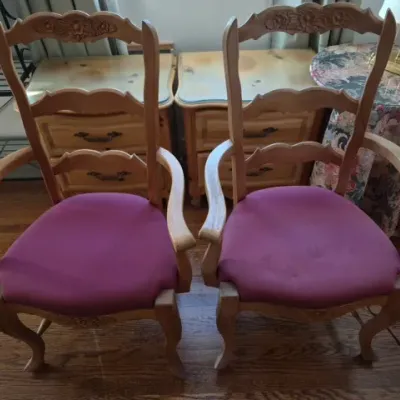 Sale Photo Thumbnail #57: Pair of light wood French Provincial style armchair dining chairs with carved crest rails and purple upholstered seats.