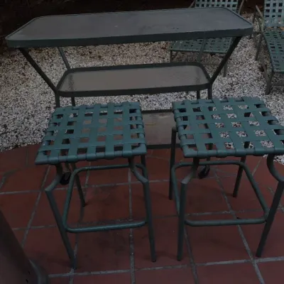 Sale Photo Thumbnail #15: Vintage green aluminum patio set including two woven vinyl bar stools and a two-tier rolling cart.