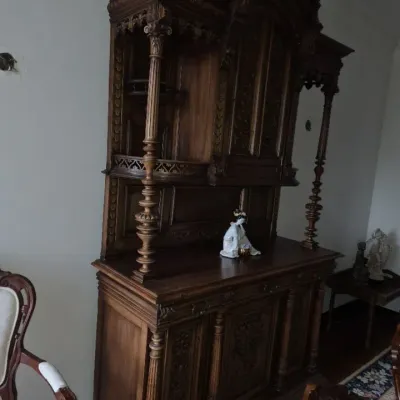 Sale Photo Thumbnail #5: Antique Renaissance Revival carved dark wood buffet server with upper hutch display shelves, turned columns, and elaborate relief carvings.