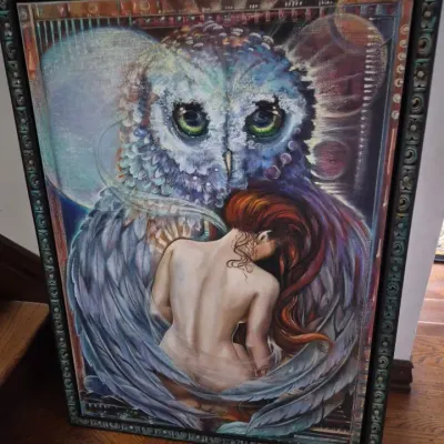 Sale Photo Thumbnail #28: Large framed fantasy artwork depicting a woman embraced by a giant celestial owl, presented in an ornate verdigris-style frame.
