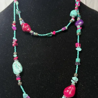 Bohemian-style necklace is a handcrafted piece of natural and dyed stones.