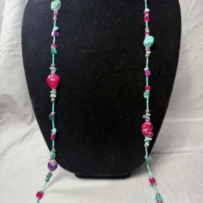 Bohemian-style necklace is a handcrafted piece of natural and dyed stones.