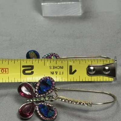 Betsey Johnson dangle earrings featuring mismatched butterfly