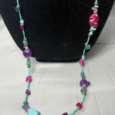 Bohemian-style necklace is a handcrafted piece of natural and dyed stones.