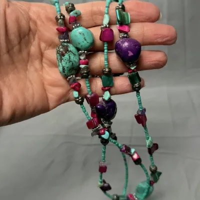 Bohemian-style necklace is a handcrafted piece of natural and dyed stones.