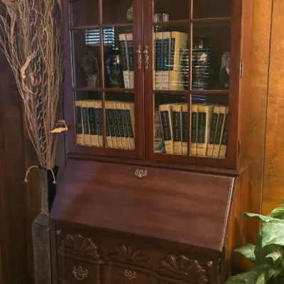Sale Photo Thumbnail #21: Vintage mahogany secretary desk with a bonnet top hutch, glass display doors, and carved shell drawer details.
