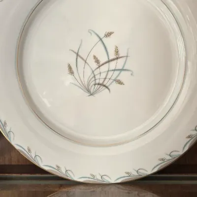 Sale Photo Thumbnail #12: Vintage fine china dinner plate featuring a mid-century stylized wheat grass pattern with teal accents and gold rim trim.