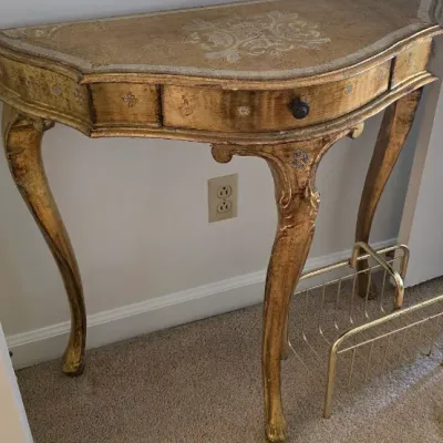 Sale Photo Thumbnail #30: Italian Florentine giltwood demilune console table featuring hand-painted scrolls, a small single drawer, and cabriole legs.