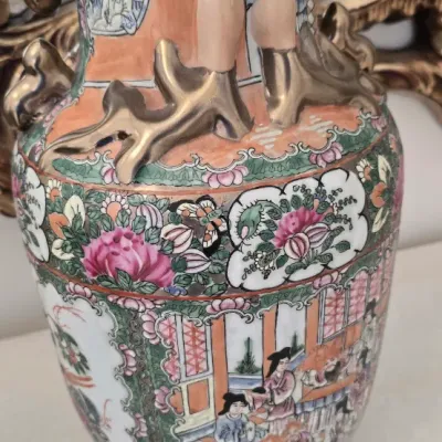 Sale Photo Thumbnail #45: Vintage Rose Medallion porcelain vase featuring hand-painted court scenes, floral panels, and gilt applied handles.