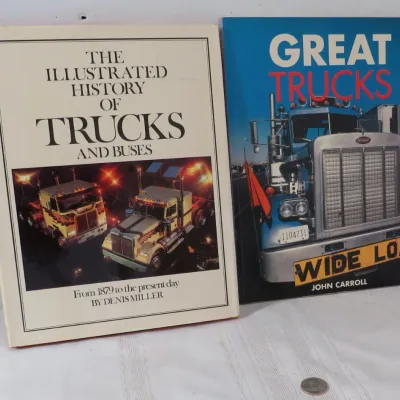 Two hardcover coffee table books about commercial vehicles, including "The Illustrated History of Trucks and Buses" by Denis...