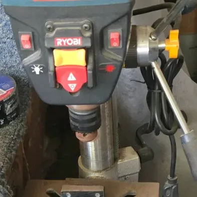 Sale Photo Thumbnail #42: Ryobi benchtop drill press with attached drill press vise and C-clamp.