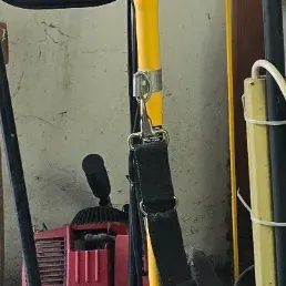 Sale Photo Thumbnail #80: Ryobi TP30 EZ Start Plus gas-powered string trimmer attachment stored alongside garden equipment in a garage.