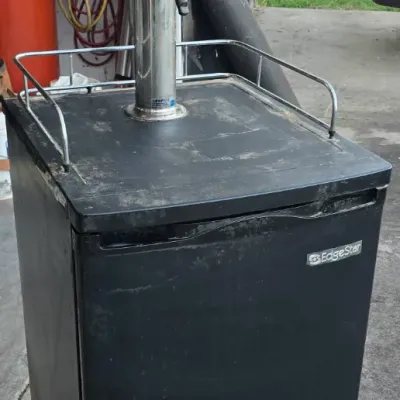 Sale Photo Thumbnail #70: EdgeStar freestanding kegerator in black, featuring a single tap tower topped with a novelty guitar-shaped Budweiser tap handle.