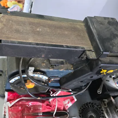 Sale Photo Thumbnail #43: Benchtop belt and disc sander combo unit showing heavy surface dust and signs of workshop use.