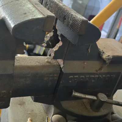 Sale Photo Thumbnail #46: Craftsman 5 1/2 inch heavy-duty bench vise with swivel base and integrated anvil area.