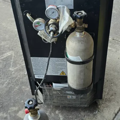 Sale Photo Thumbnail #65: EdgeStar black kegerator shown from the rear, featuring attached pressure gauges and two aluminum CO2 tanks.