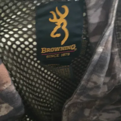 Sale Photo Thumbnail #27: Browning camouflage jacket with mesh lining, size 3XL, featuring the embroidered yellow Buckmark logo tag.