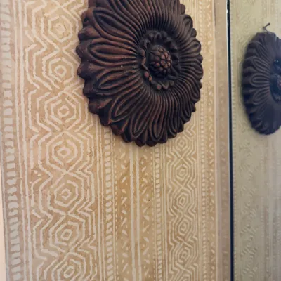 Vintage dark-finished carved wooden sunflower wall hanging plaque.