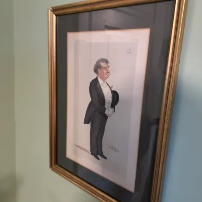 Framed vintage Vanity Fair caricature print by 'Spy' featuring a gentleman in formal evening wear, presented in a black mat and...