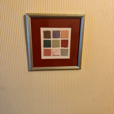 Framed contemporary 3D mixed media artwork featuring a grid of colored paper swatches in a metallic frame.