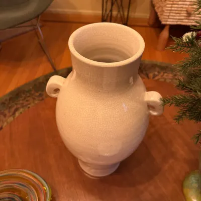 Large white glazed ceramic urn-style vase featuring small side handles and an all-over crackle finish.