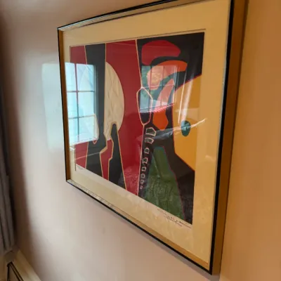 Framed mid-century abstract art print with bold geometric shapes, featuring a signature and edition numbering at the bottom.