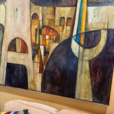 Large mid-century modern abstract oil painting featuring geometric shapes, archways, and warm earth tones, set in a thin metallic frame.