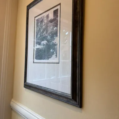 Framed black and white architectural photograph set in a wide white mat and dark antiqued frame.